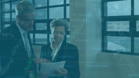 Colleagues Analyzing Financial Data on Tablet