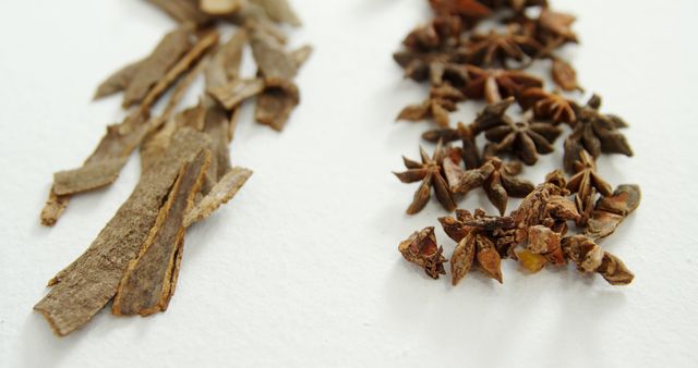 Close-Up of Dried Star Anise and Cinnamon Bark on White Background - Download Free Stock Images Pikwizard.com