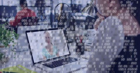 Remote team collaborating over video call on laptop in open office with data binary overlay