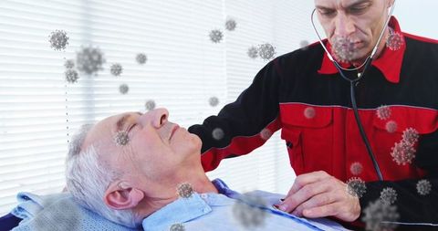 Paramedic conducting health check on elderly patient amid viral concerns