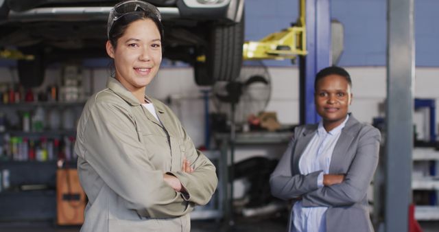 Female Mechanic and Professional Woman Posing in Auto Shop - Download Free Stock Images Pikwizard.com