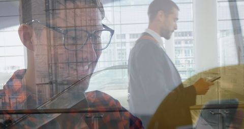 Caucasian Businessman Walking While Using Smartphone
