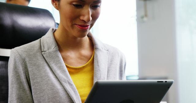 Businesswoman Working on Digital Tablet in Office - Download Free Stock Images Pikwizard.com