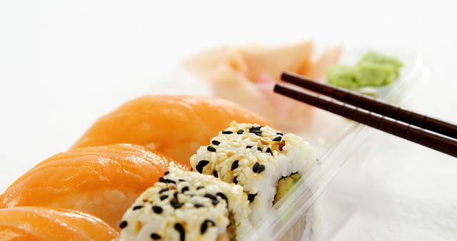 Close-Up of Sushi Platter with Chopsticks - Download Free Stock Images Pikwizard.com