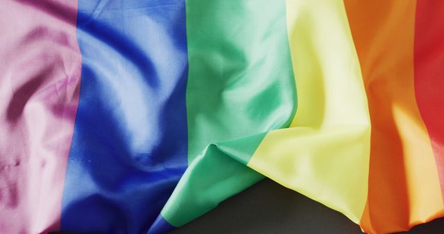 Brightly colored LGBTQ pride flag displaying its rainbow stripes. Useful for promoting inclusivity, supporting LGBTQ events, advertising pride celebrations, or celebrating diversity and equality in various media forms.