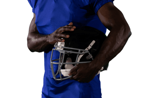 Athlete holding rugby helmet against black jersey on transparent bg