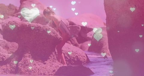 Playful child adventure in rocky waters with heart lights