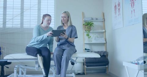 Rehabilitation consultation with therapist and patient using prosthetic limb