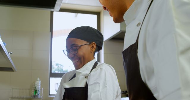 Chefs Smiling and Cooking Together in Restaurant Kitchen - Download Free Stock Images Pikwizard.com