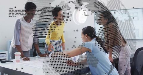 Diverse team collaborating around table with digital globe data overlay in modern office