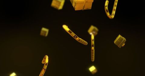 Golden gifts and candy canes falling over dark background