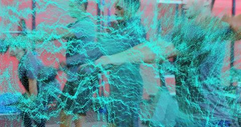 Business team collaborating with teal particle mesh overlay and data visualization