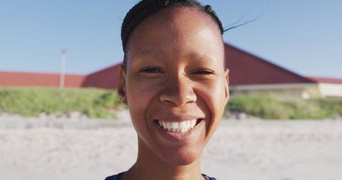 Smiling Woman Enjoying Beach Outdoors on a Sunny Day