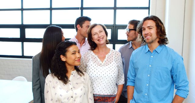 Diverse Office Team Engaging in Friendly Conversation - Download Free Stock Images Pikwizard.com