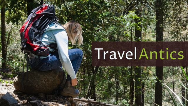 This image features a woman wearing a backpack sitting on a rock in a forest. The image includes the text 'Travel Antics' on a brown band overlay. Ideal for use in travel blogs, adventure articles, nature exploration content, and outdoor activity promotions.