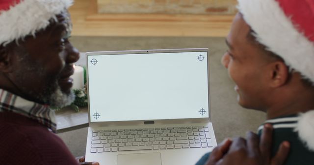 Father and Son Celebrating Christmas with Laptop Video Call - Download Free Stock Images Pikwizard.com