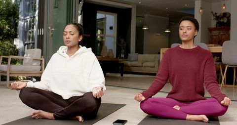 Diverse Friends Practicing Meditation Indoors