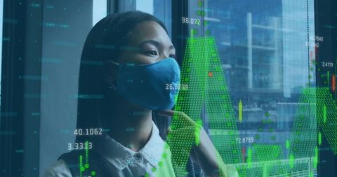 Businesswoman Analyzing Data with Financial Overlay Downtown