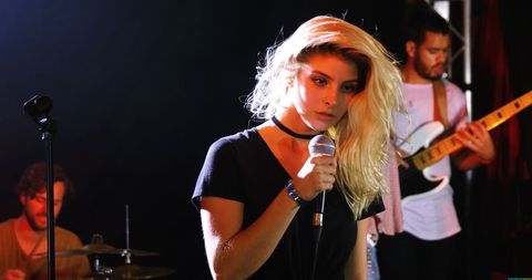 Young Female Singer Performing Dynamic Live Band Show - Download Free Stock Images Pikwizard.com