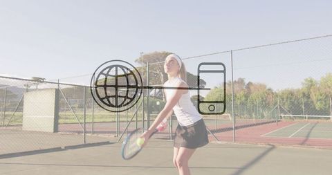 Female Tennis Player Strikes Ball on Outdoor Court
