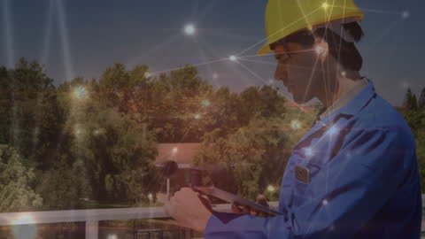 Engineer Using Anemometer With Digital Network Overlay