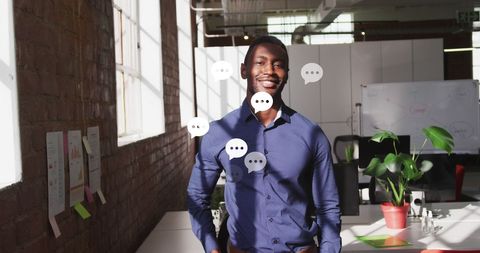 Businessman Smiling in Office with Social Media Icons