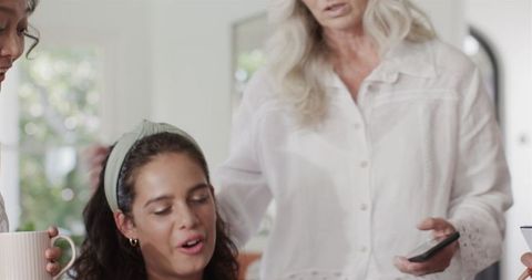 Women collaborating on wedding plans with enthusiastic discussion