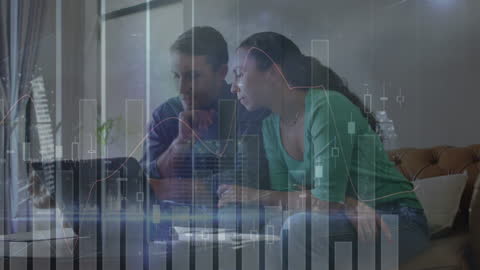 Diverse Couple Analyzing Financial Data on Laptop