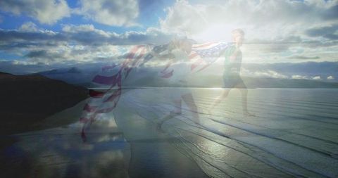 Caucasian siblings running with flag over double exposure seascape