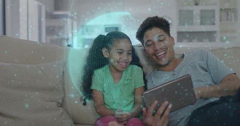 African American Father and Daughter Exploring Virtual Globe on Tablet for Family Learning