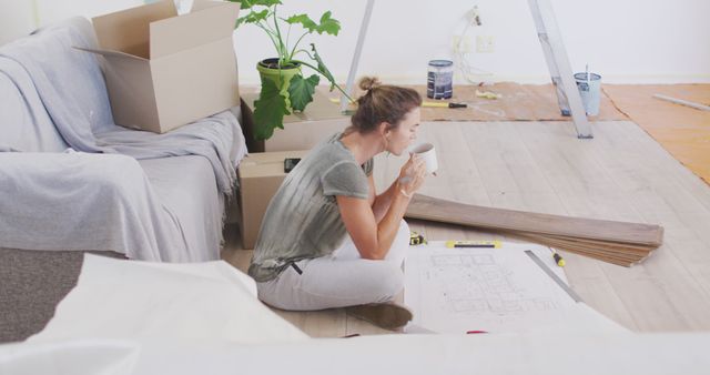 Woman Taking Coffee Break Amid Home Renovation - Download Free Stock Images Pikwizard.com