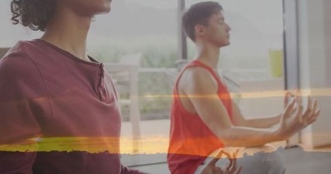 Friends meditating indoors with sunrise overlay for holistic wellness