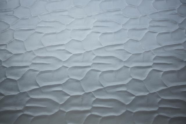 This image features a close-up of an old wall with peeled plaster, showcasing a textured and abstract background. Ideal for use in design projects, architectural presentations, or as a backdrop for artistic compositions. The rough surface and vintage texture add a sense of history and character, making it suitable for themes related to construction, renovation, or interior design.