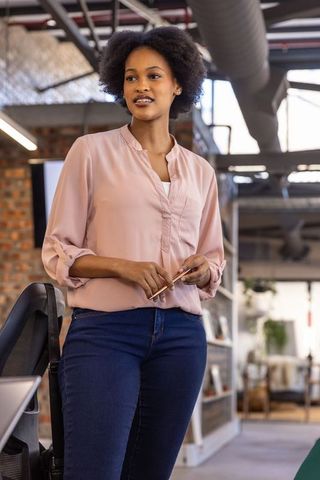 Confident Professional Woman in Modern Industrial Office Environment