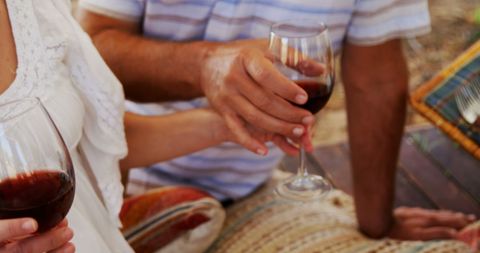 Middle-Aged Couple Enjoying Red Wine Outdoors - Download Free Stock Images Pikwizard.com