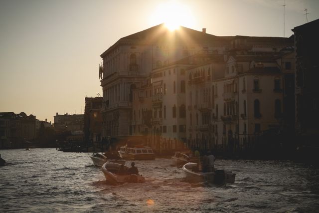 Capturing the tranquil beauty of Venice during sunset with silhouettes of historical buildings and boats on the water, this scene evokes a sense of calm and nostalgia. Ideal for travel blogs, tourism promotions, and romantic getaway advertisements, this image highlights the charm and timeless appeal of one of Italy's most iconic cities.