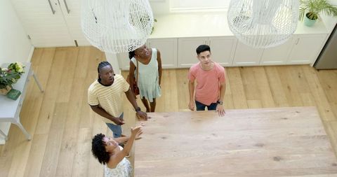Diverse Friends Enjoying Time Together in Bright Modern Kitchen