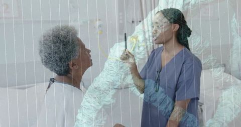 Nurse checking elderly patient at bedside using smartphone double exposure healthcare