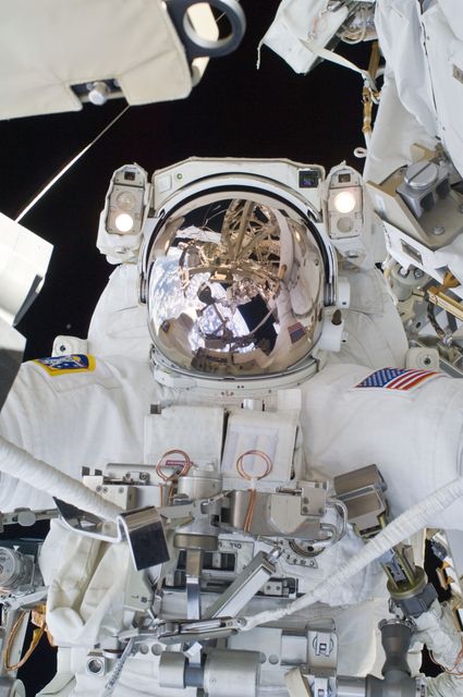 Astronaut engaged in a spacewalk for maintenance on the ISS. Suitable for topics on space exploration, scientific research in space, astronaut training, and engineering feats. Could be used for educational articles, space-related publications, or promoting space programs.