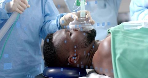 Medical Professionals Preparing Patient for Surgery with Anesthesia