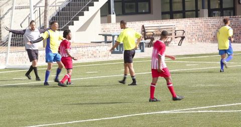 Referee Calls Foul During Intense School Soccer Match