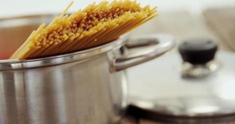 Raw Spaghetti in Stainless Steel Pot on Stove - Download Free Stock Images Pikwizard.com