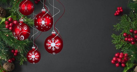 Christmas Decorations with Red Ornaments on Dark Background