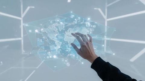 Hand Interacting with Futuristic Holographic World Map