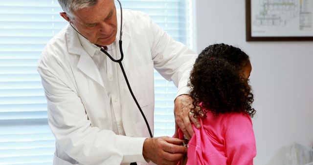 Doctor Examining Young Girl with Stethoscope in Medical Office - Download Free Stock Images Pikwizard.com