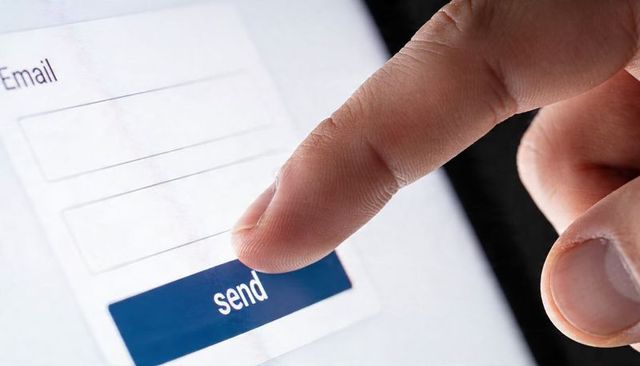 Tapping Send Button on Tablet Screen Closeup Sending Email with Fingertip on Touchscreen