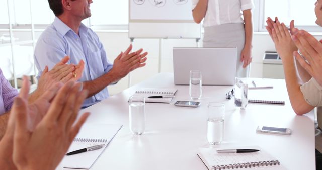 Colleagues Applauding Business Presentation in Office Meeting Room - Download Free Stock Images Pikwizard.com