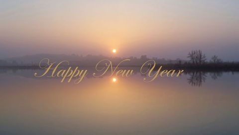 Golden Happy New Year Script Reflecting on Misty Pastel Lake Sunrise for Holiday Greeting