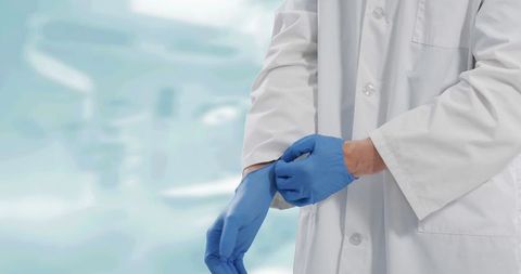Medical Professional Preparing for Procedure with Gloves