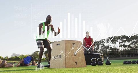 Athlete doing plyometric box jump during outdoor group training with kettlebells
